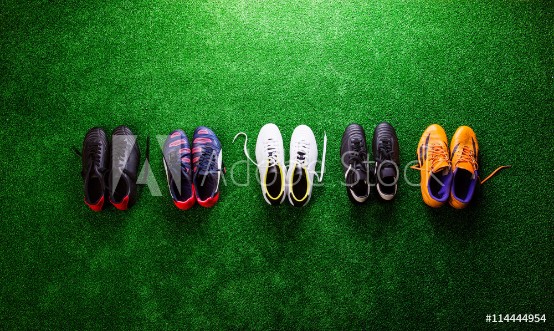 Picture of Various cleats against green artificial turf studio shot